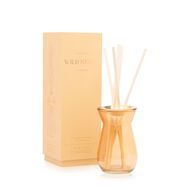 Flora Bulb Orange Glass Diffuser Wild Neroli faces flora bulb orange glass diffuser wild neroli