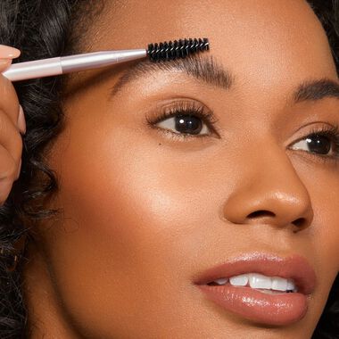 Dual-Ended Brow Brush faces dual ended brow brush